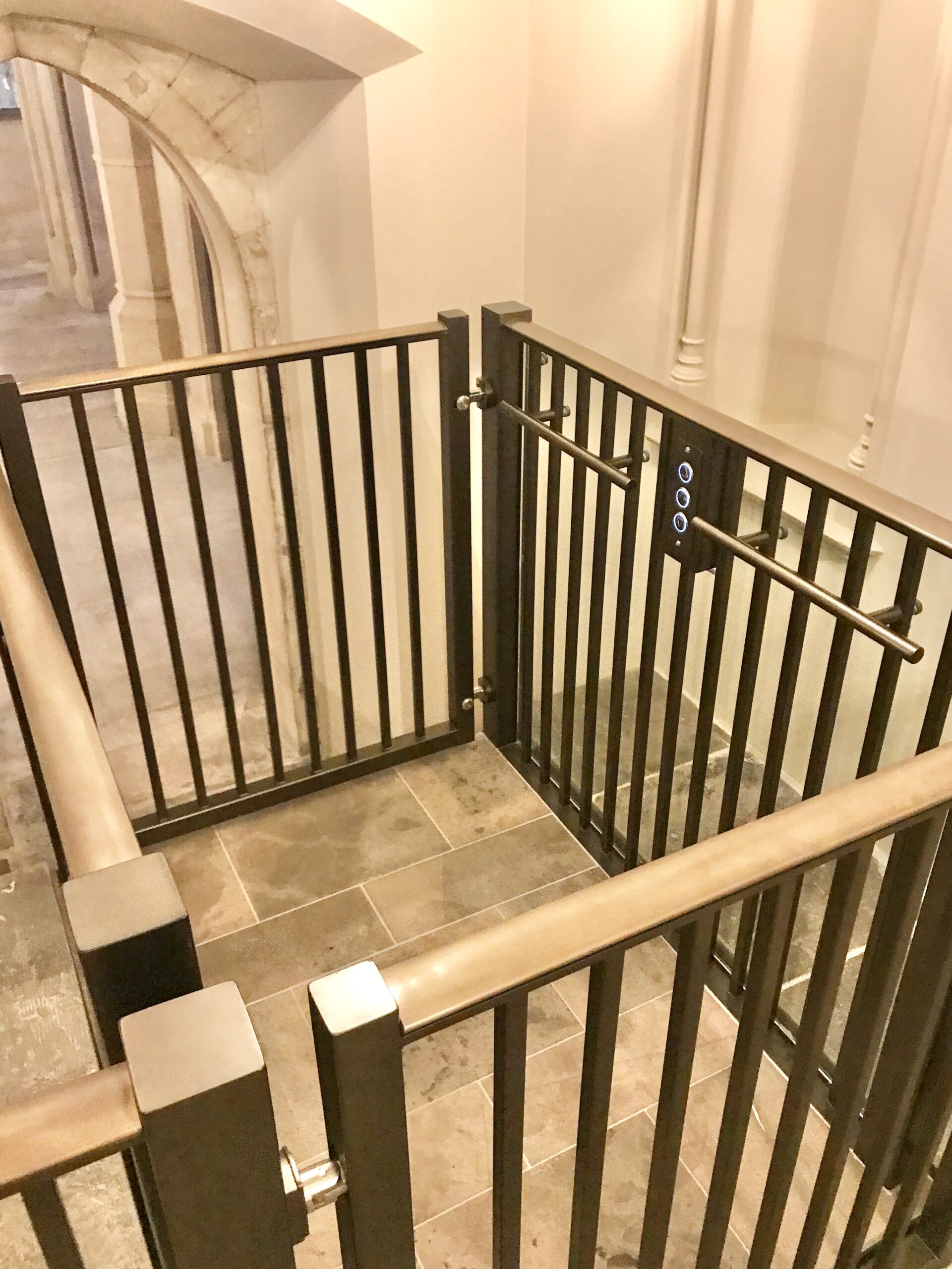 Discreet platform lift with oak handrail at Windsor Castle