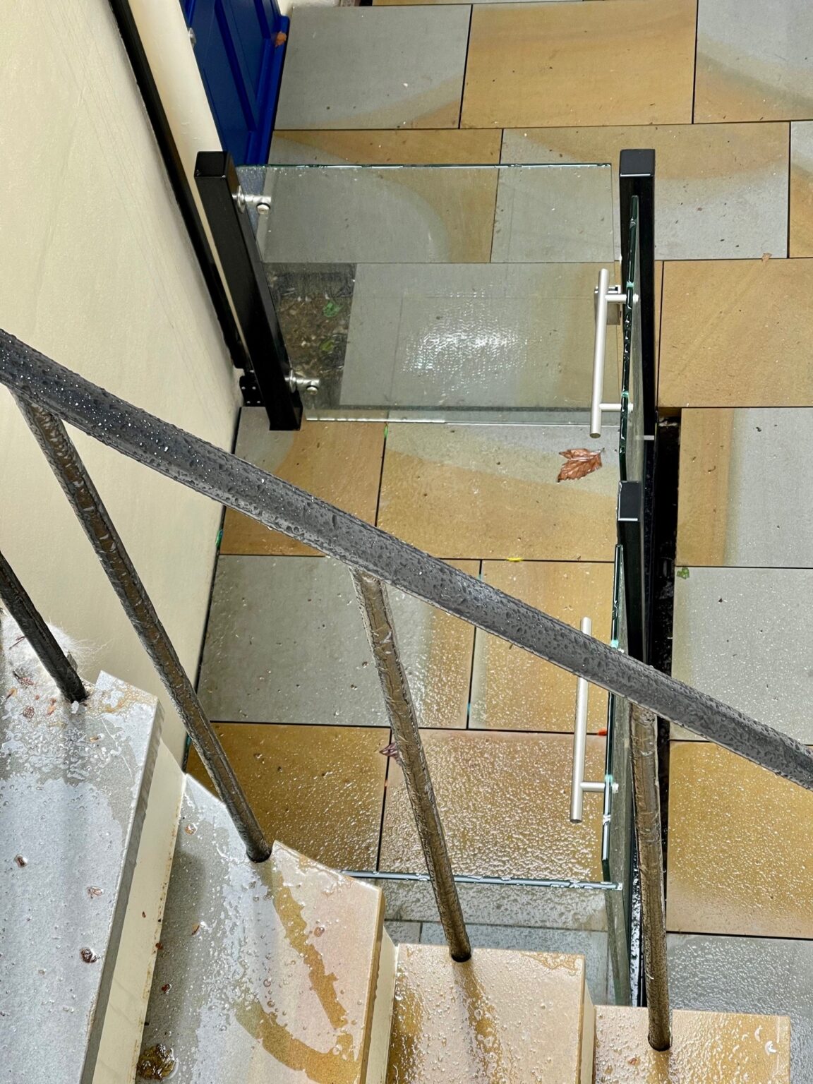 Lightwell platform lift beside stone steps