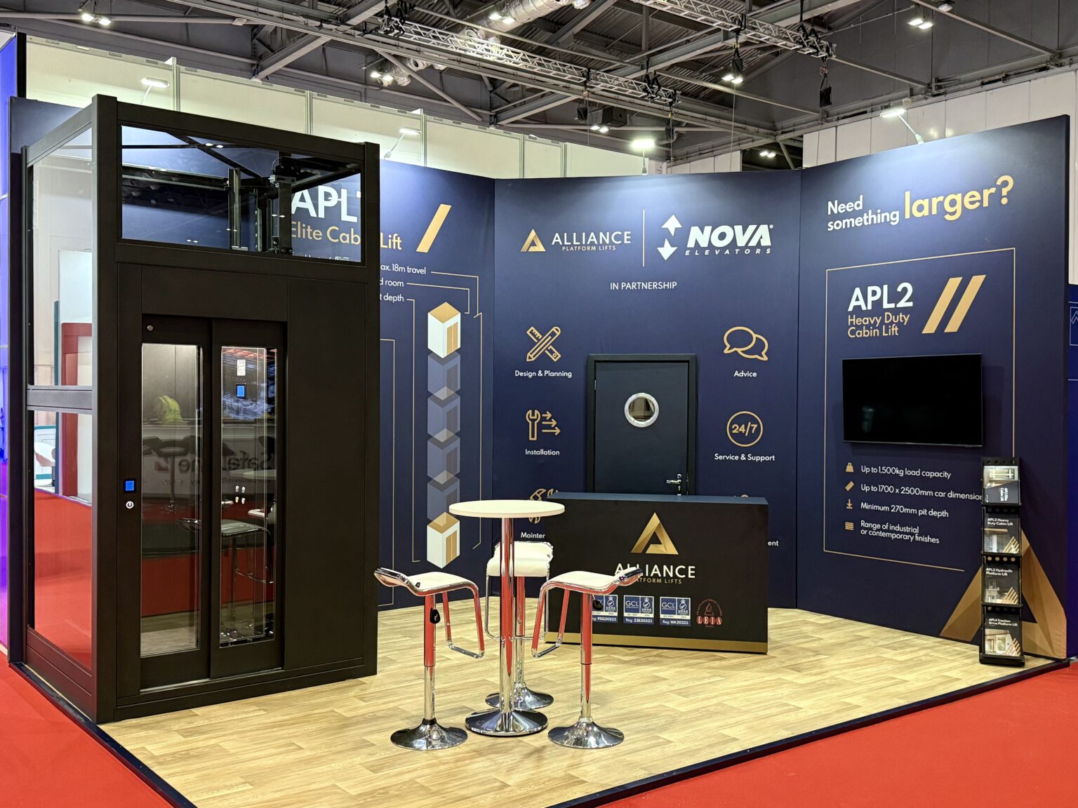 Alliance Platform Lifts and Nova Elevators stand at LIFTEX with an APL Elite Cabin Lift