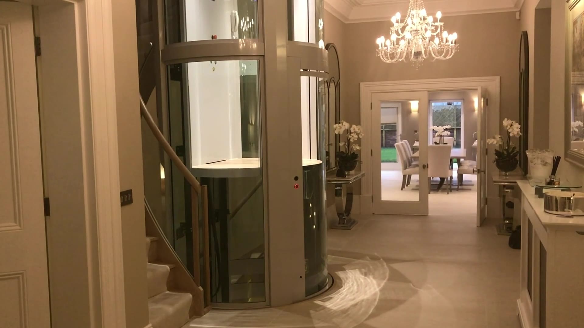 Oval APL Circular Glass Cabin Lift in a residential hallway