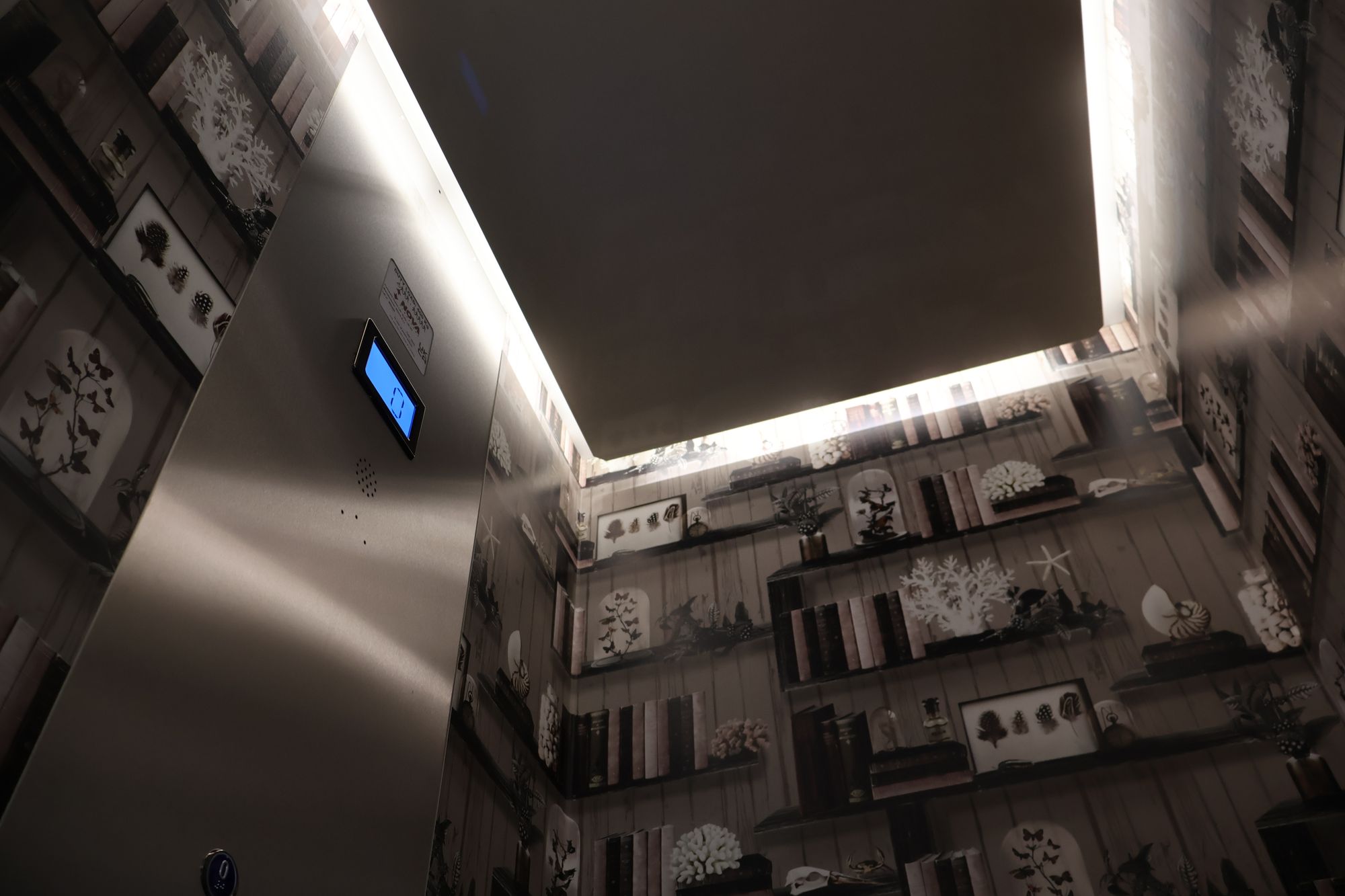 Cabin lift interior with lit ceiling
