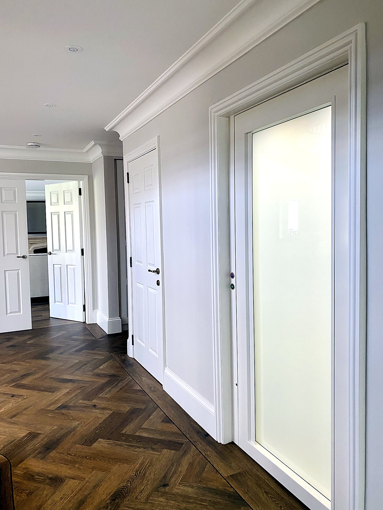Cabin lift with frosted glass door in a family home