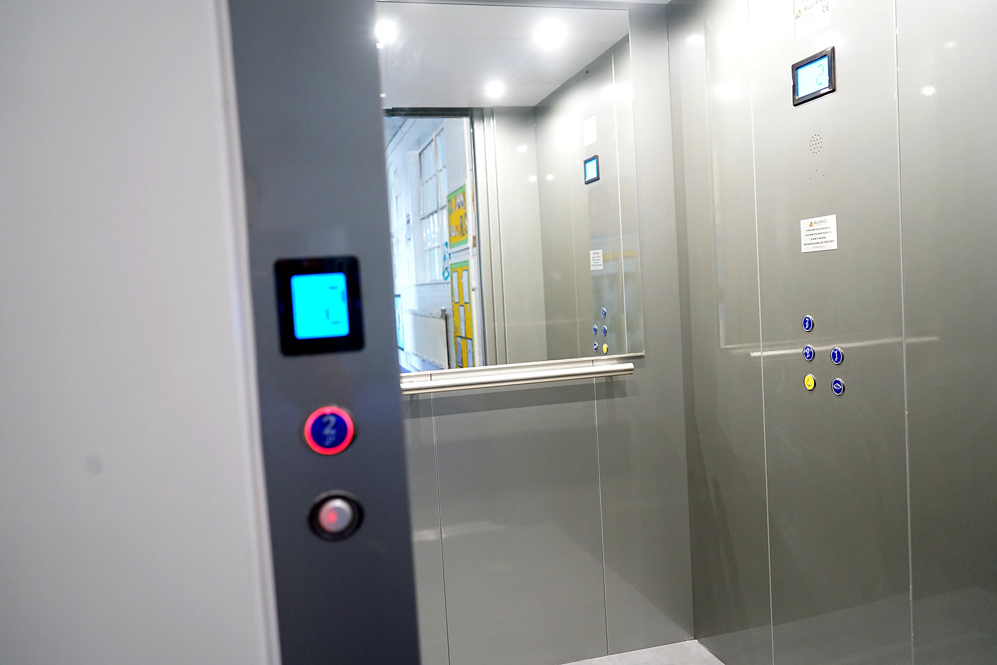 Cabin lift interior with control panel