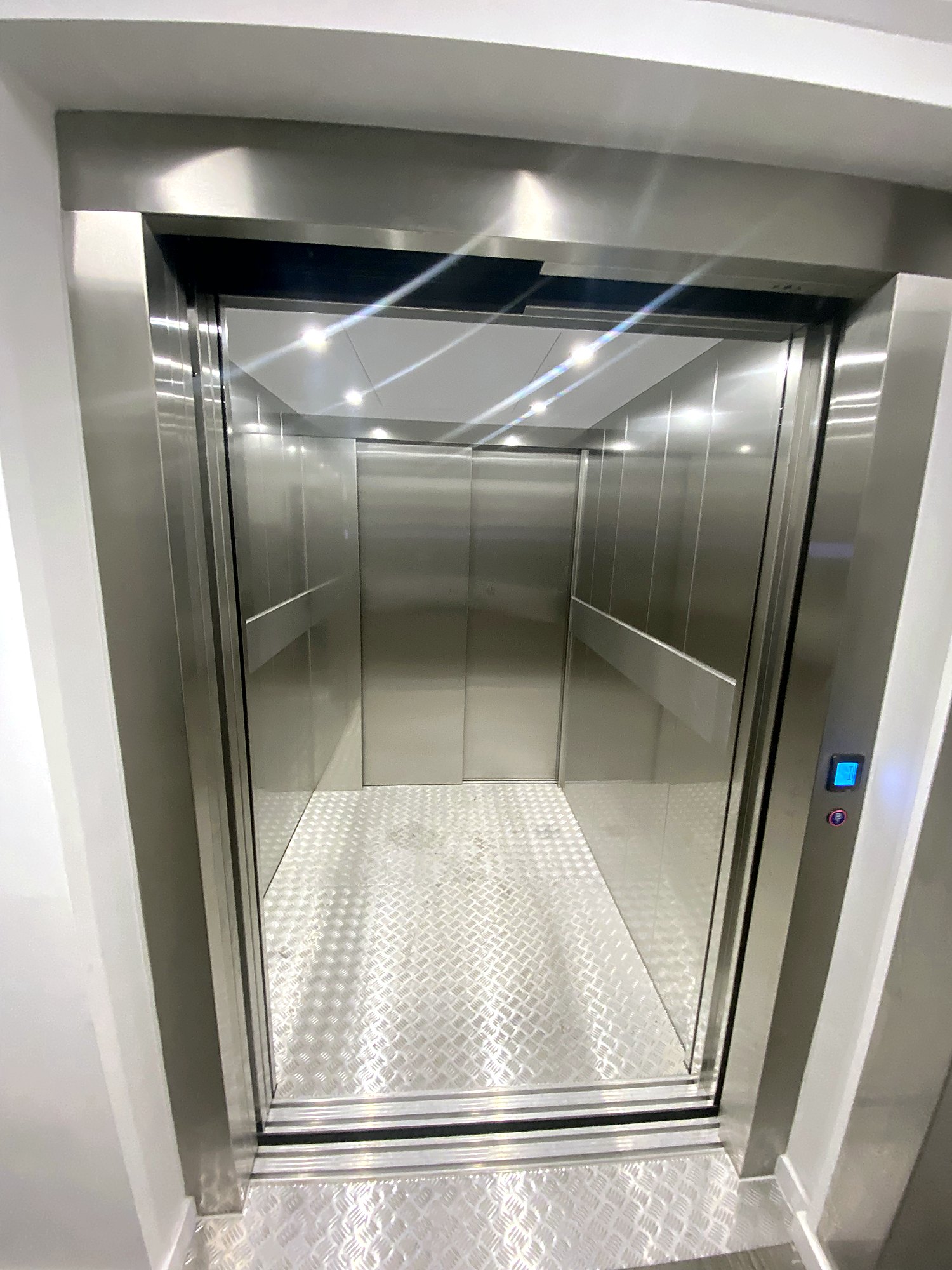 Heavy-Duty Cabin Lift with doors open at a residential cycle store