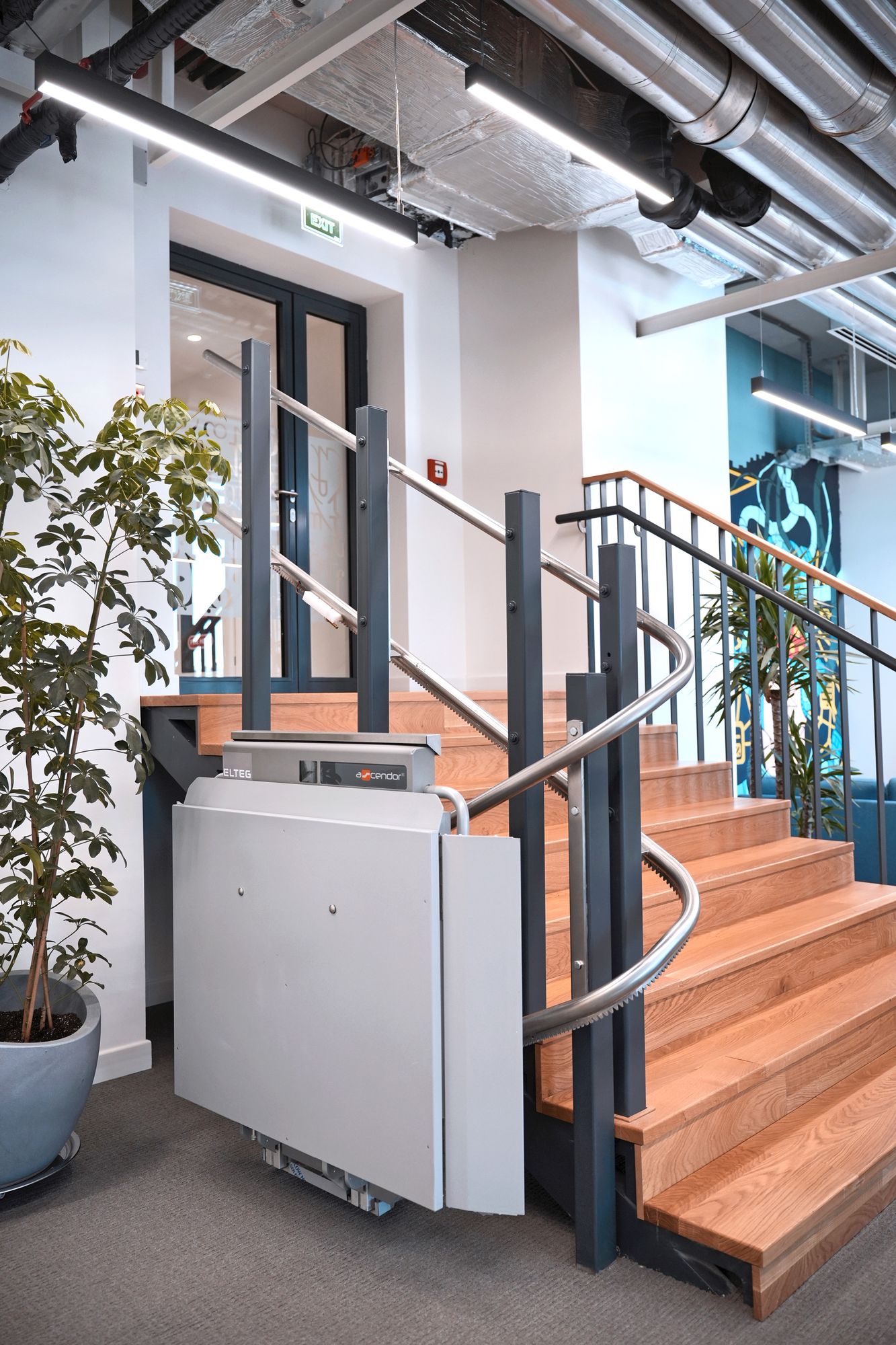 APL Inclined Platform Lift on a curved office staircase