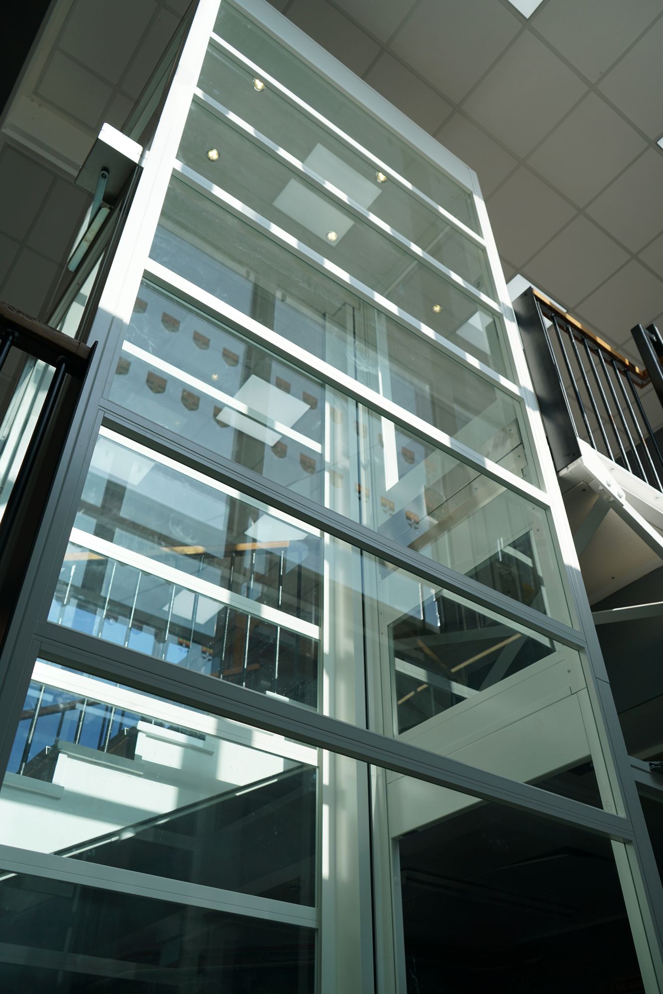 APL Chain-Driven Platform Lift in a university glass shaft